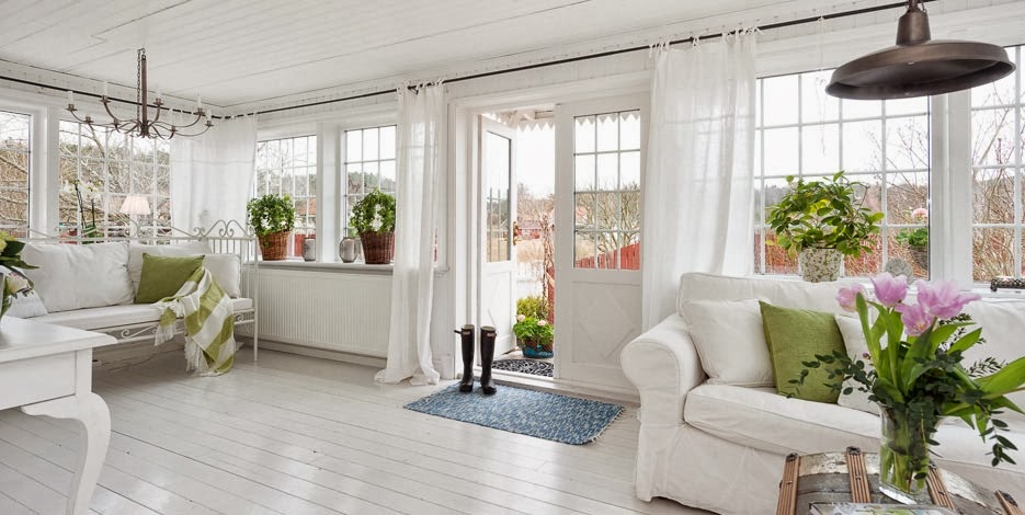 White Sun room with sofa and open door to outside | Pink Shoe Cleaning Crew | House Cleaning Omaha