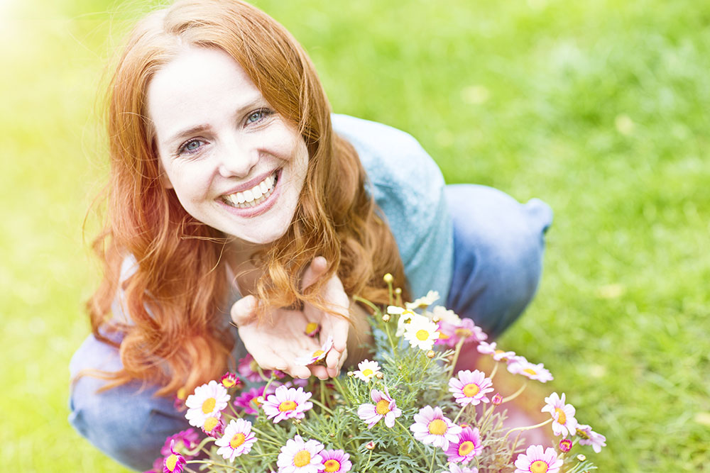 Woman with a spring floral arrangement